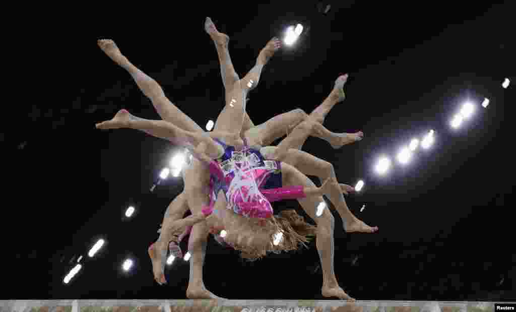 Australia&#39;s Olivia Vivian performs at the women&#39;s All-Around Artistic Gymnastics at the 2014 Commonwealth Games in Glasgow, Scotland, July 30, 2014. (Picture taken with multiple exposure function)