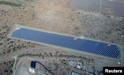 FILE - A solar field is seen north of Johannesburg, South Africa, July 9, 2016.