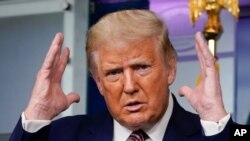 President Donald Trump gestures while speaking during a news conference at the White House, Sept. 27, 2020, in Washington.