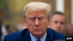 FILE - Former President Donald Trump appears in the courtroom for his civil fraud trial at New York State Supreme Court on Oct. 24, 2023 in New York. On Sunday, a federal judge reinstated a gag order in a Washington case against Trump. 