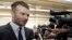 David Beckham responds to a question following a news conference where he announced he will exercise his option to purchase a Major League Soccer expansion team in Miami, Feb. 5, 2014, in Miami. 