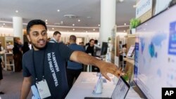 FILE - Tarjimly co-founder Atif Javed presents his app at the Google Impact Summit on Sept. 4, 2024, in Sunnyvale, Calif.