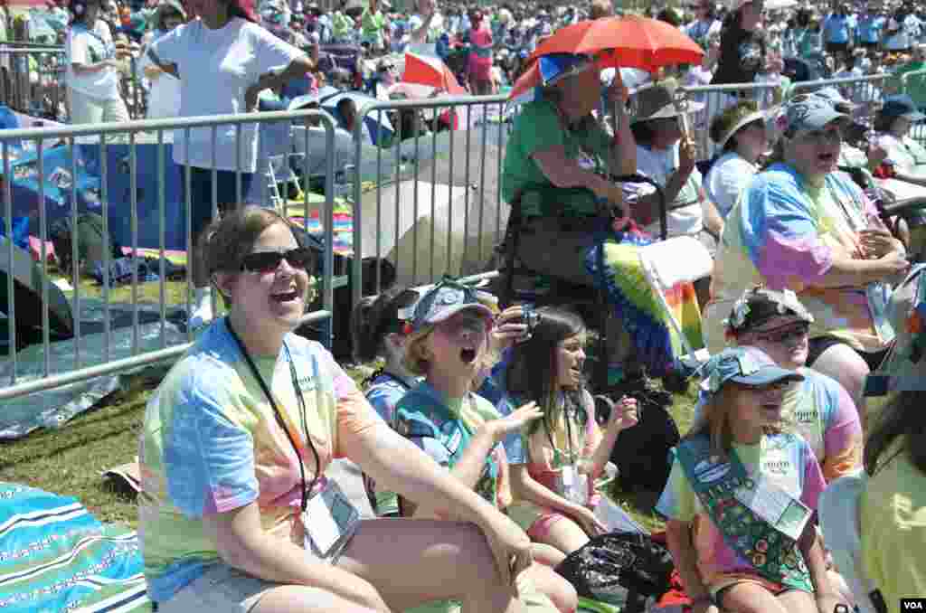 A man, holding a national flag with a poster of Turkey's founder Kemal Ataturk, watches as thousands of Turks clash with security as they try to break through barricades mounted around the prison and courthouse complex in Silivri, in the outskirts of Istanbul.
