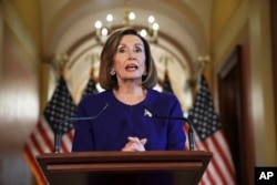 House Speaker Nancy Pelosi of Calif., reads a statement announcing a formal impeachment inquiry into President Donald Trump, on Capitol Hill in Washington, Tuesday, Sept. 24, 2019.