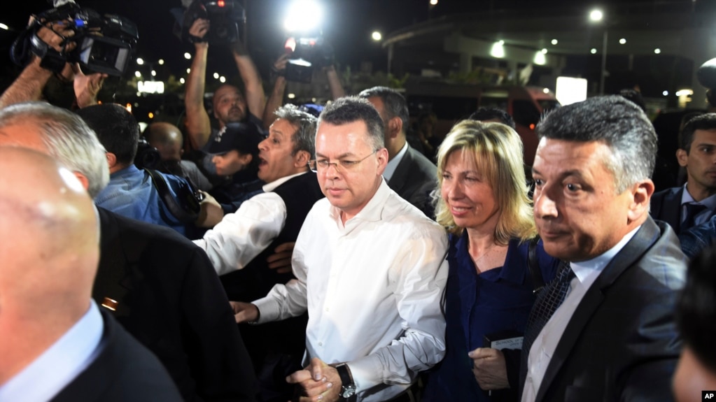 Pastor Andrew Brunson, center left, and his wife Norine Brunson arrive at Adnan Menderes airport for a flight to Germany after his release following his trial in Izmir, Turkey, Oct. 12, 2018.