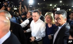 FILE - Pastor Andrew Brunson, center left, and his wife Norine Brunson arrive at Adnan Menderes airport for a flight to Germany after his release following his trial in Izmir, Turkey, Oct. 12, 2018,