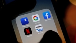 Description: The logos of mobile apps, Google, Amazon, Facebook, Apple and Netflix, are displayed on a screen in this illustration picture taken December 3, 2019. REUTERS/Regis Duvignau