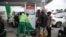 FILE: People queue at a petrol station in Lagos, Nigeria. Taken Friday, Feb. 18, 2022
