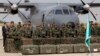 Lebanese army soldiers stand in front of French weapons at the Rafik Hariri International Airport in Beirut, Lebanon, April 20, 2015. The weapons were paid for by Saudi Arabia.