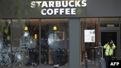 Великобритания: беспорядки распространились на Манчестер и Бирмингем