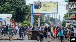 Protesters fill the street as police deploy in Maputo, Mozambique, Nov. 7, 2024. 