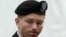 FILE - U.S. Army Private First Class Bradley Manning enters the courtroom for day four of his court martial at Fort Meade, Maryland, June 10, 2013. 