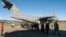 Guatemalan migrants walk from a U.S. military plane after being deported from U.S. at the Guatemalan Air Force Base in Guatemala City, Jan. 24, 2025. (Handout photo/Guatemalan Migration Institute/AFP