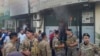 Lebanese soldiers gather outside a damaged mobile shop after what is believed to be the result of a walkie-talkie exploding inside it, in the southern port city of Sidon, Lebanon, Sept. 18, 2024.