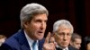 U.S. Defense Secretary Chuck Hagel (R) listens as Secretary of State John Kerry testifies on Capitol Hill in Washington, Sept. 3, 2013, before the Senate Foreign Relations Committee hearing to advance President Barack Obama's request for congressional aut