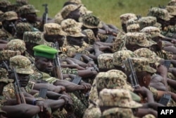 FILE - Soldiers of the Uganda People's Defense Force (UPDF) attend a special event before starting their service under the African Union Mission in Somalia (AMISOM) at the Singo military camp, 75km north of Kampala, April 12, 2018.