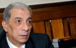 FILE - Egyptian public prosecutor Hisham Barakat is seen in his office in Cairo, Egypt, July 10, 2013.