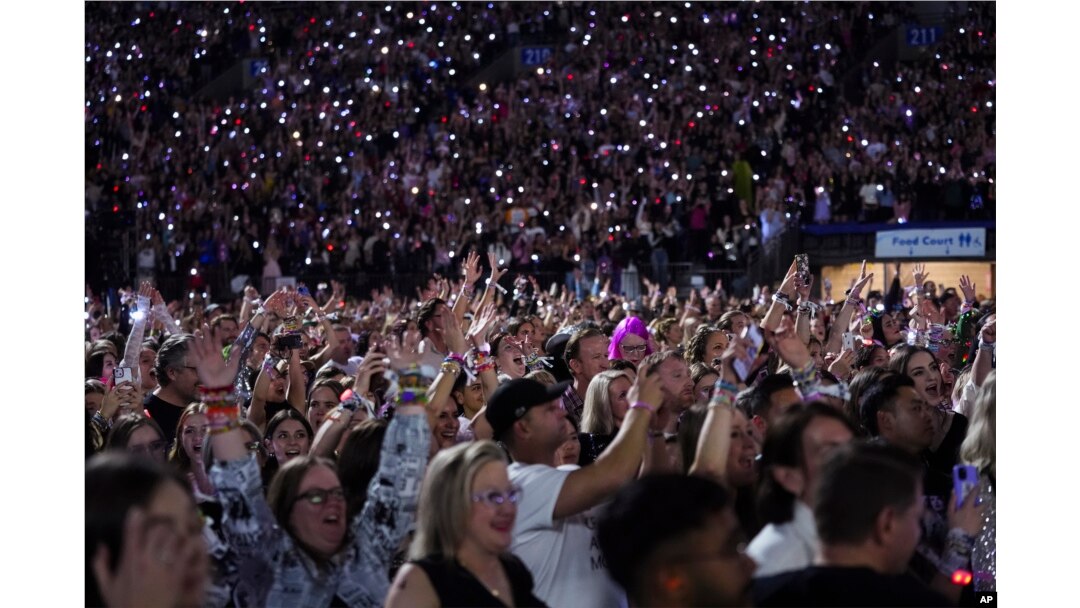 Concertgoers watch on during Taylor Swift's "The Eras Tour," Dec. 6, 2024, in Vancouver, British Columbia.