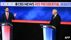 US Senator and Republican vice presidential candidate J.D. Vance (L) and Minnesota Governor and Democratic vice presidential candidate Tim Walz participate in the Vice Presidential debate hosted by CBS News at the CBS Broadcast Center in New York City on 