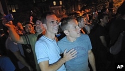 Carl Bazil and Eric Price celebrate in Manhattan's west village following the passing of the same-sex marriage bill by the New York Senate, June 24, 2011