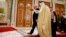President Donald Trump walks with Saudi King Salman to a photo with leaders of the Gulf Cooperation Council Summit, at the King Abdulaziz Conference Center, May 21, 2017, in Riyadh.