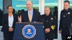 Sean Ragan, FBI special agent in charge, briefs reporters about a crash at the main gate of Travis Air Force Base, Calif., March 23, 2018. 