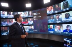 FILE - Harvard Business School Professor Bharat Anand demonstrates an online classroom that allows real-time discussion between professors and students from around the world.