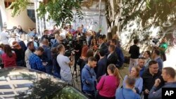 Journalists protest outside the offices of soccer club Sarajevo in Sarajevo, Bosnia, Sept. 30, 2019.