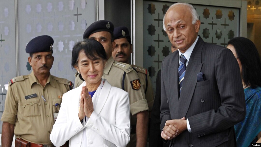 Burma's opposition leader Aung San Suu Kyi at the Indira Gandhi international airport where she was greeted by India's Foreign Secretary Ranjan Mathai (R), New Delhi, November 13, 2012.
