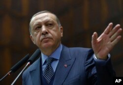 Turkey's President Recep Tayyip Erdogan addresses his supporters at the parliament in Ankara, Turkey, Nov. 28. 2017.