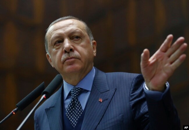 FILE - Turkey's President Recep Tayyip Erdogan addresses his supporters at the parliament in Ankara, Turkey, Nov. 28, 2017.