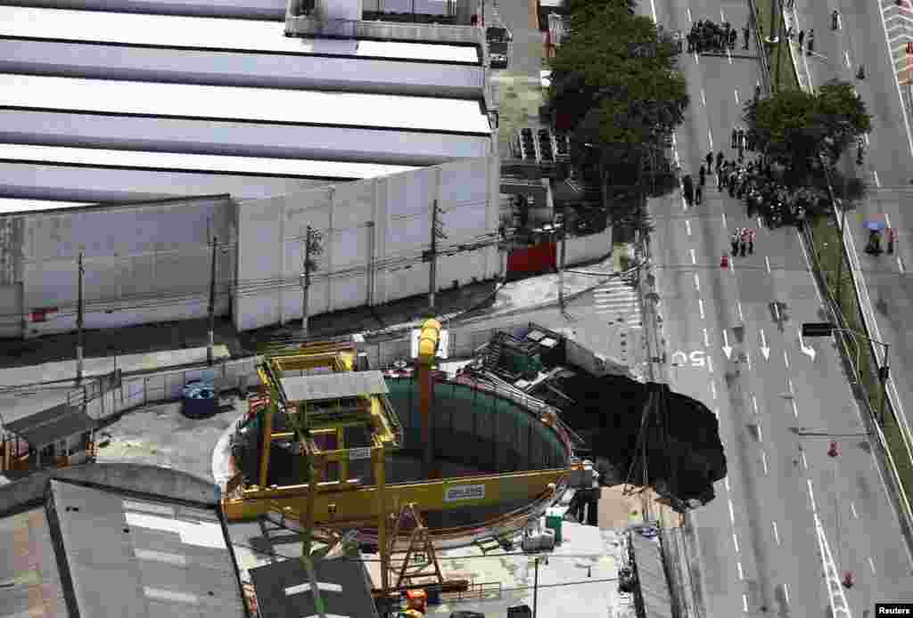 An aerial view shows part of an expressway collapsed above a construction site where Spain&#39;s Acciona SA was excavating a tunnel for a new metro line in Sao Paulo, Brazil.