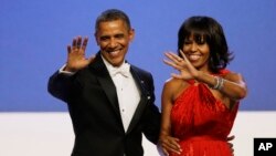 President Barack Obama and Michelle Obama wave to guests after their dance at the Inaugural Ball at the 57th Presidential Inauguration in Washington, Jan. 21, 2013.