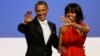 President Barack Obama and Michelle Obama wave to guests after their dance at the Inaugural Ball at the 57th Presidential Inauguration in Washington, Jan. 21, 2013.