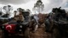 FILE - A Turkish soldier is seen atop the Bursayah hill in Syria's Afrin district, March 3, 2018. Since Turkey took control of Afrin, rights groups and Kurdish activists have accused Turkey and its allies of settling Arab and Turkmen families in the predominately Kurdish region. 