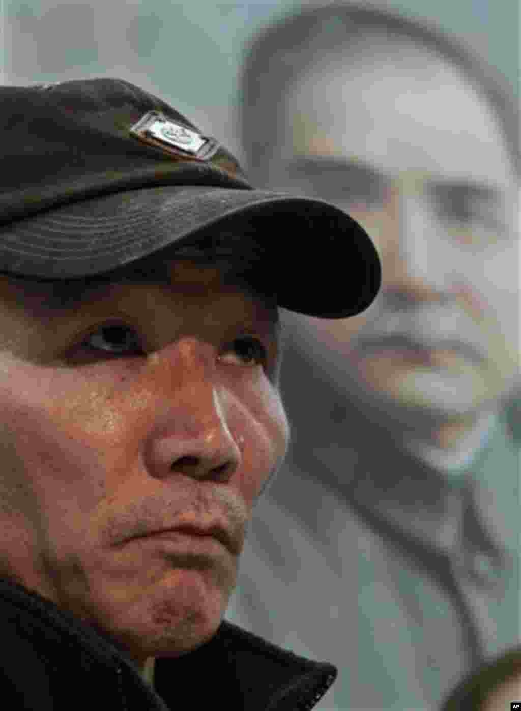 Yan Tao Chen, the father of Pvt. Danny Chen, listens during a news conference on Thursday, Jan. 5, 2012 in New York. (AP Photo)