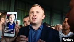 Gubernatorial candidate Andrei Ischenko, representing Russian Communist Party, meets with supporters during a rally following the election for governor of Primorsky Region in the far eastern city of Vladivostok, Russia, Sept. 17, 2018.