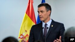 FILE - In this file photo dated July 2, 2019, Spanish Prime Minister Pedro Sanchez speaks during a media conference during an EU summit in Brussels. 
