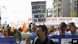 Protesters shout slogans during demonstration in Athens, Oct. 5, 2011.