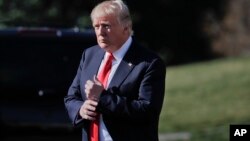 FILE - President Donald Trump walks out of the Oval Office of the White House in Washington, Feb. 24, 2017, before boarding Marine One.