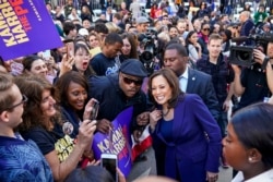 FILE - Supporters take photos with U.S. Sen. Kamala Harris after she formally launched her presidential campaign at a rally in her hometown of Oakland, California, Jan. 27, 2019.