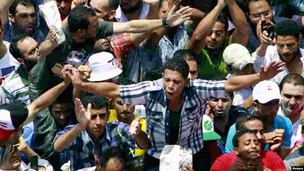 Supporters of the Muslim Brotherhood shout slogans during a demonstration in Tahrir Square.