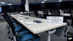 FILE - This room in Bethesda, Md., was prepared Feb. 16, 2018, for election officials from all 50 states to attend the first of two classified briefings being held to raise awareness of foreign meddling in state election systems. The briefings were hosted