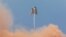 SpaceX's Mars Starship prototype "Starhopper" hovers over its launchpad during a test flight in Boca Chica, Texas, Aug. 27, 2019.