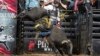 FILE - Amadeu Campos Silva (Brazil) menunggangi banteng Yippee High Cowboy di Grand Rapids, Michigan, Agustus 2021. (Andre Silva/Courtesy PBR/Bull Stock Media via AP)