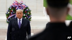 President Donald Trump participates in a Veterans Day wreath laying ceremony at the Tomb of the Unknown Soldier at Arlington National Cemetery in Arlington, Va., Nov. 11, 2020.