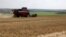 FILE - A combine harvests wheat near Kramatorsk, in Donetsk region on August 4, 2023, amid the Russian invasion of Ukraine.