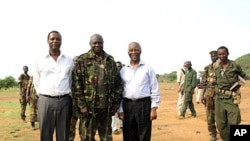 A picture released by Thabo Mbeki's spokesman shows former President of Burundi Pierre Buyoya and AU mediator for the Sudan crisis Thabo Mbeki with Sudan People's Liberation Army (SPLA) commander, Abdel Aziz al-Hilu (C), at his military headquarters in S