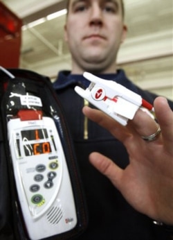 A Montpelier, Vermont, firefighter shows a device used to test if a person is suffering from carbon monoxide poisoning