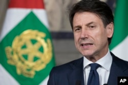 FILE - Giuseppe Conte addresses the media at the Quirinale presidential palace in Rome, May 31, 2018.